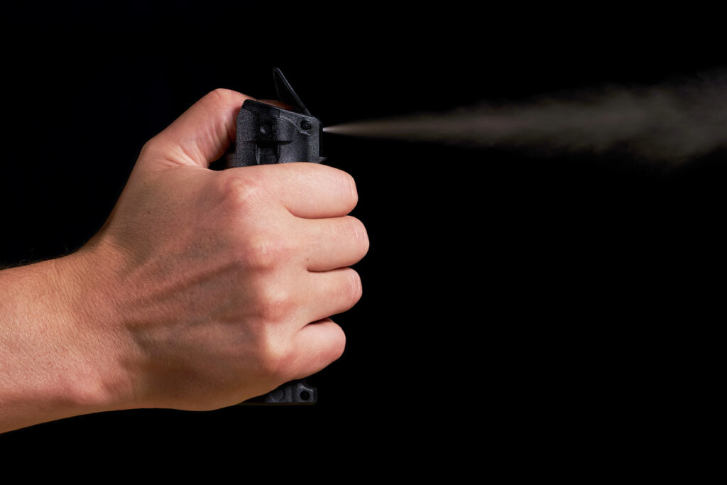 A hand spraying pepper spray. Pepper spray might have prevented Daniel Penny's charge.