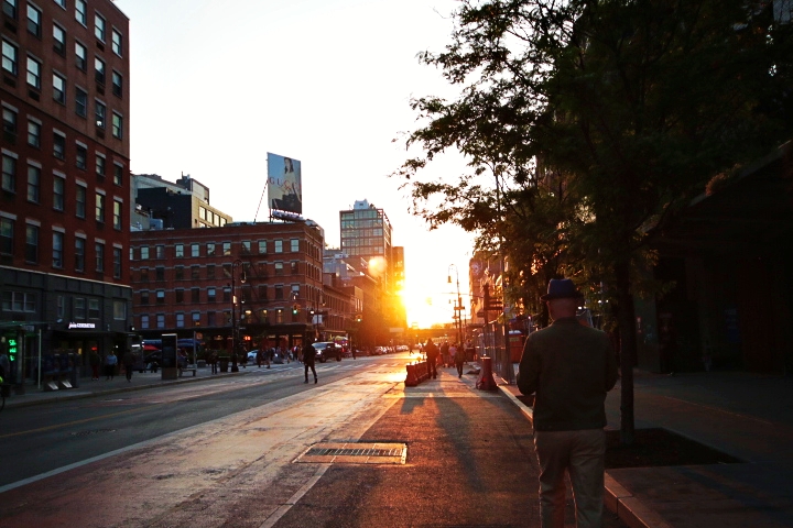 Manhattanhenge: a Celestial Phenomenon. The setting sun illuminates 14th Street and 8th Avenue with golden light.