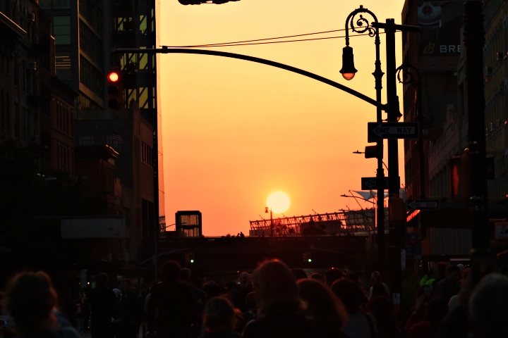 The peak of Manhattanhenge. The sun hovers directly over the center of 14th Street at 8:12 pm.