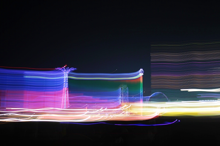  A long exposure of the Parachute Jump illuminated in red, white, and blue, and other rides. The lights made streaks, adding a nice artistic effect.