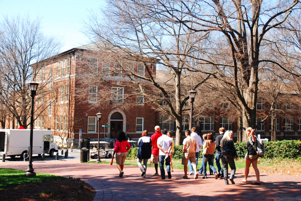 A group of university students wandering a welcoming campus. This is not the Brooklyn College campus.