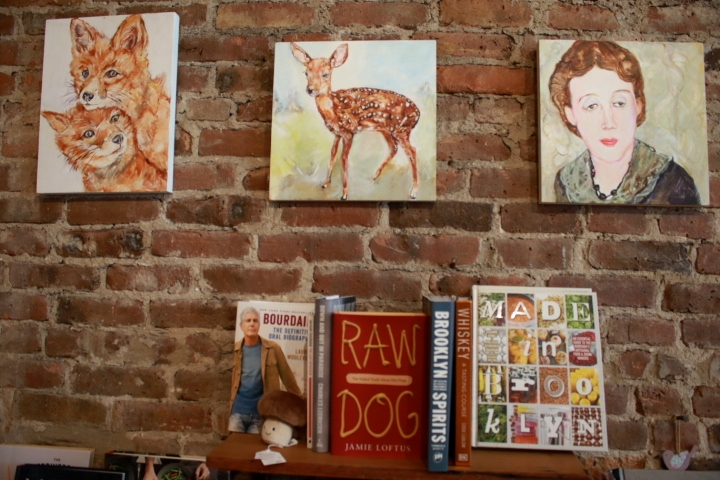 Brooklyn's indie bookstores provide community. This brick wall at Powerhouse on 8th features art from a local artist.