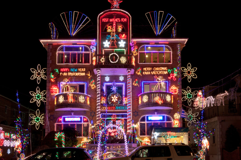 A brightly lit Dyker Heights Christmas house lights up the night and brightens the holiday spirit!